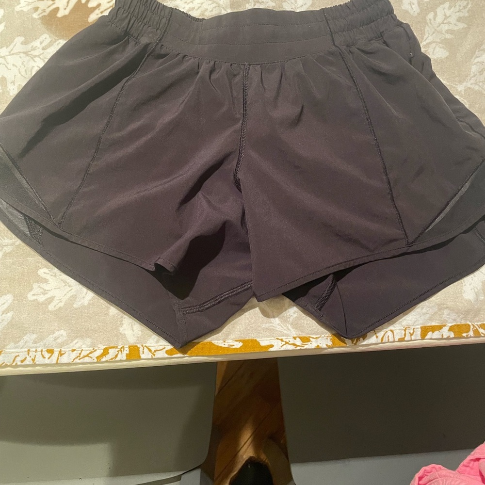 Lululemon size 4 tall short. Mesh at bottom. See pics. Great condition.